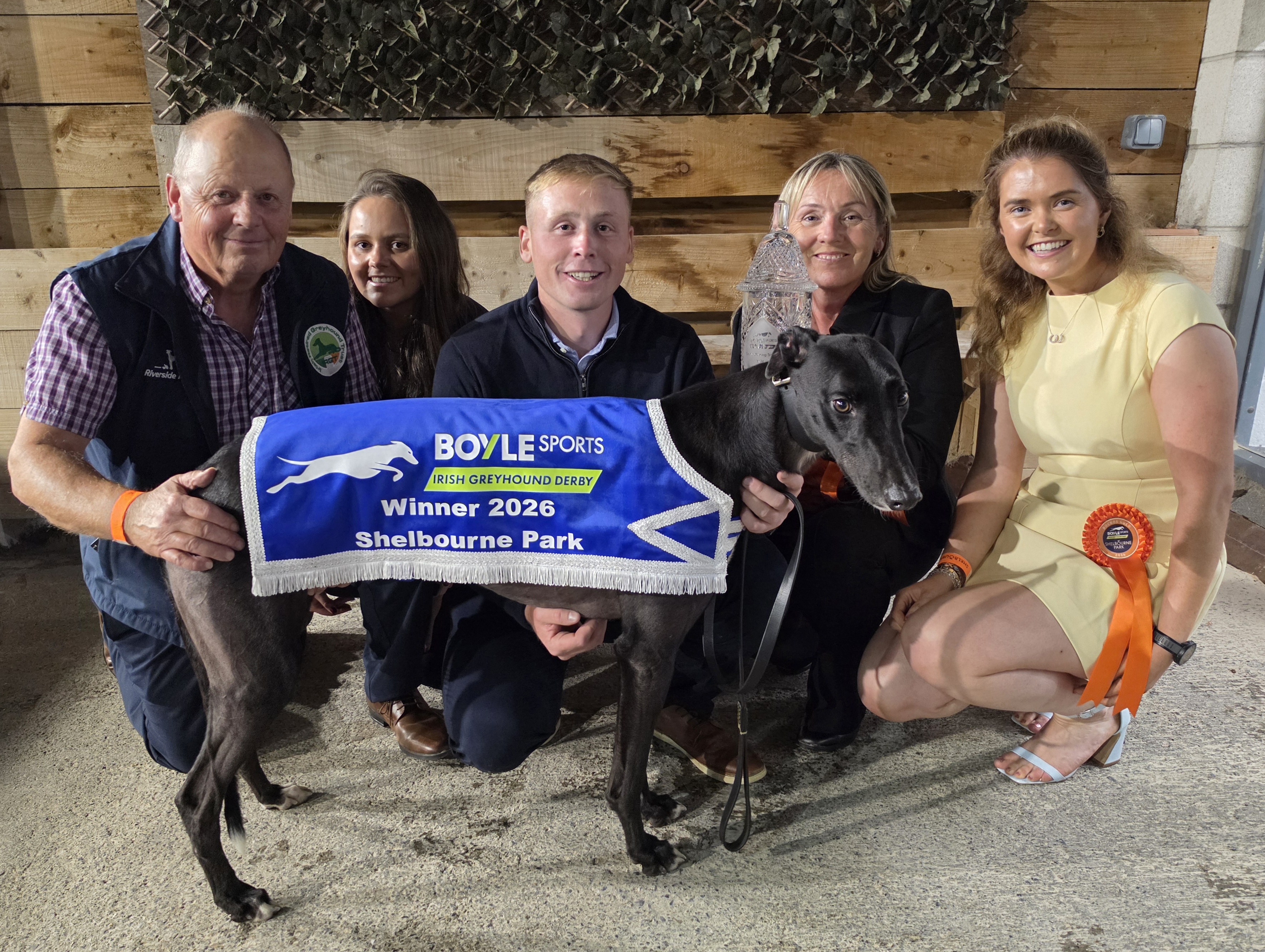 Image shows the Holland family celebrate with their record breaking sixth BOYLE Sports Irish Greyhound Derby champion, Bockos Gold. L-R Trainer Graham Holland, daughter Rachel, son Timmy, wife Nicky and Timmy's partner Sheena Murphy.