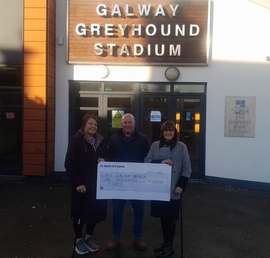 Hughie Keleghan, Chairman of the WGOBA, presents a cheque for €1,000 to MS Galway following a successful Santa Night held at Galway Greyhound Stadium, supported by the local greyhound racing community.