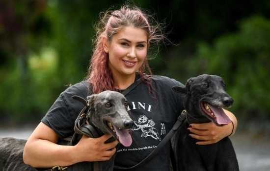 Greyhound Trainer Margaret Bolton at home with two of her beloved greyhounds