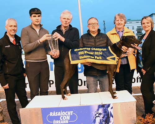 Conor Matthews Racing Support Officer Shelbourne Park Presents the trophy To Timmy Carmody after " Carmac King " won The Shelbourne Champion 550 Final , also inc are Phil Carmody ,Owen Mc Kenna (Trainer) Linda Lenihan Tote Controller and Dean Barantez-Cross tote 